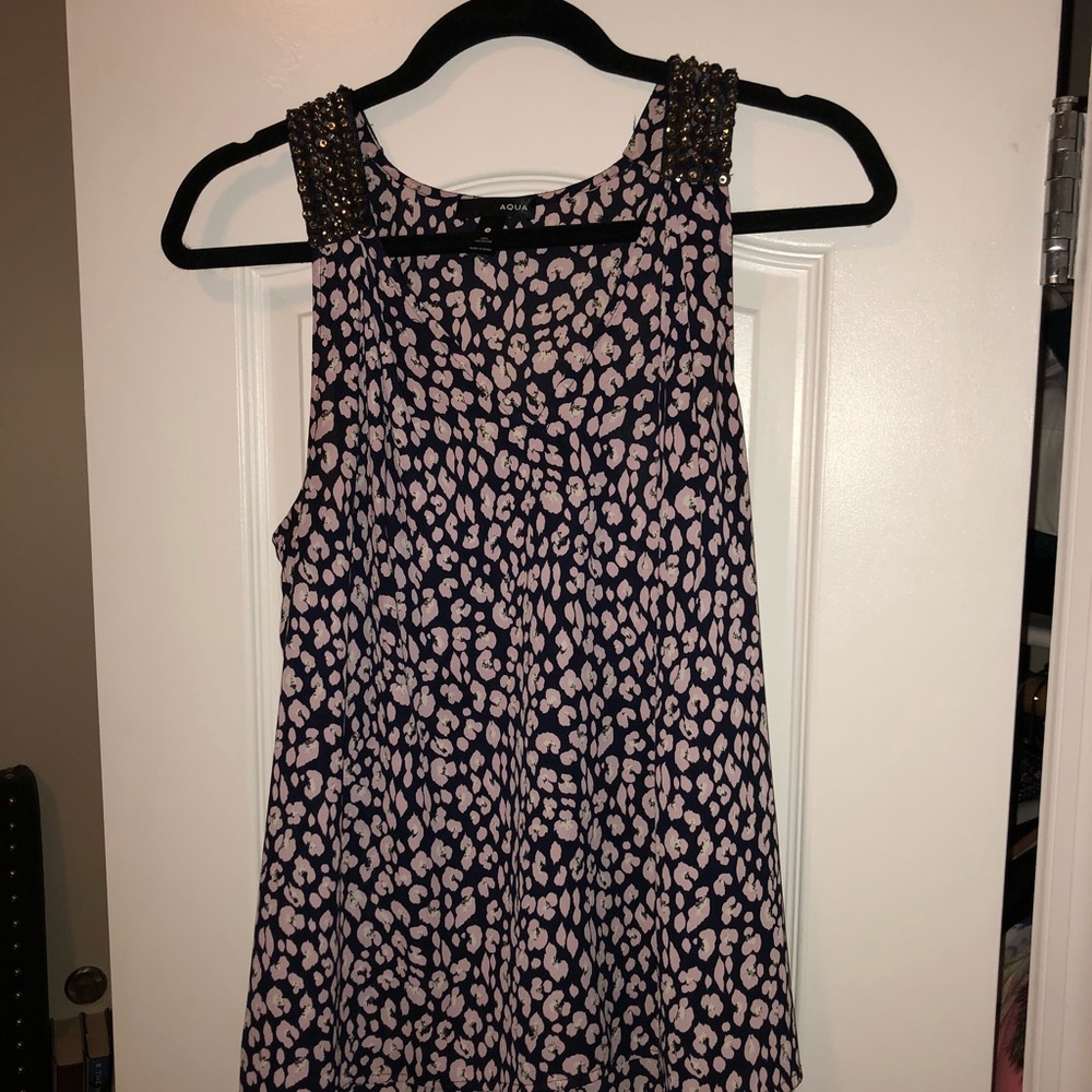 Floral tank top with beautiful beading on straps.